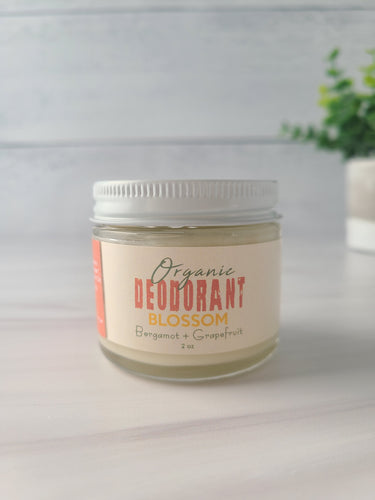 Deodorant cream in a glass jar with metal lid