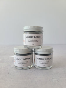 3 one ounce glass jars of armpit detox powder stacked like a pyramid 